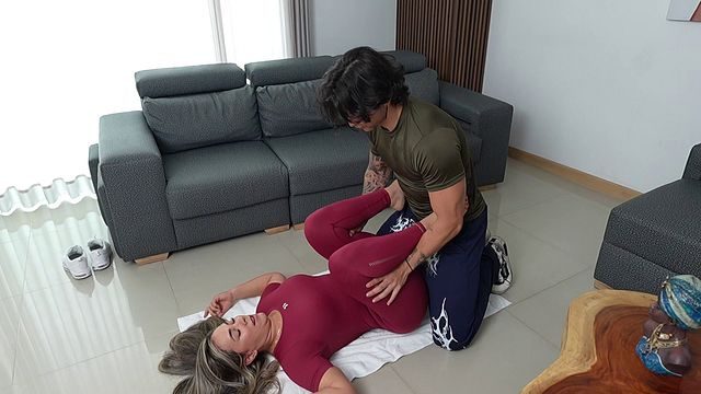 A gorgeous blonde MILF fucks her trainer, who’s got a massive cock, with her tight pussy whilst her husband’s away